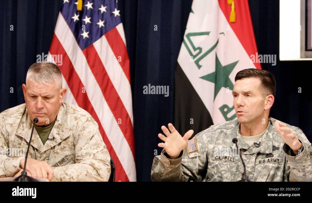 Major-General William B. Caldwell IV (R), Multi-National Force-Iraq Spokesman, speaks to the media in a joint media conference with  Brigadier-General C. Mark Gurganus, Commanding General, Ground Combat Element, Multi-National Force-West, at the heavily fortified Green Zone area in Baghdad May 16, 2007. REUTERS/Ali Abbas/Pool  (IRAQ) Stock Photo