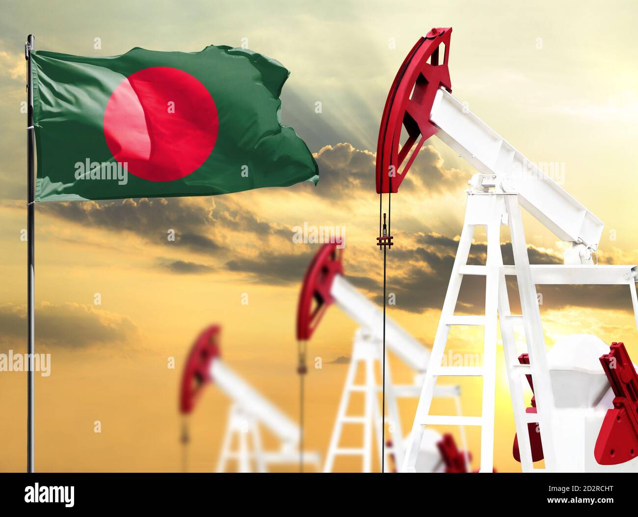 Oil rigs against the backdrop of the colorful sky and a flagpole with