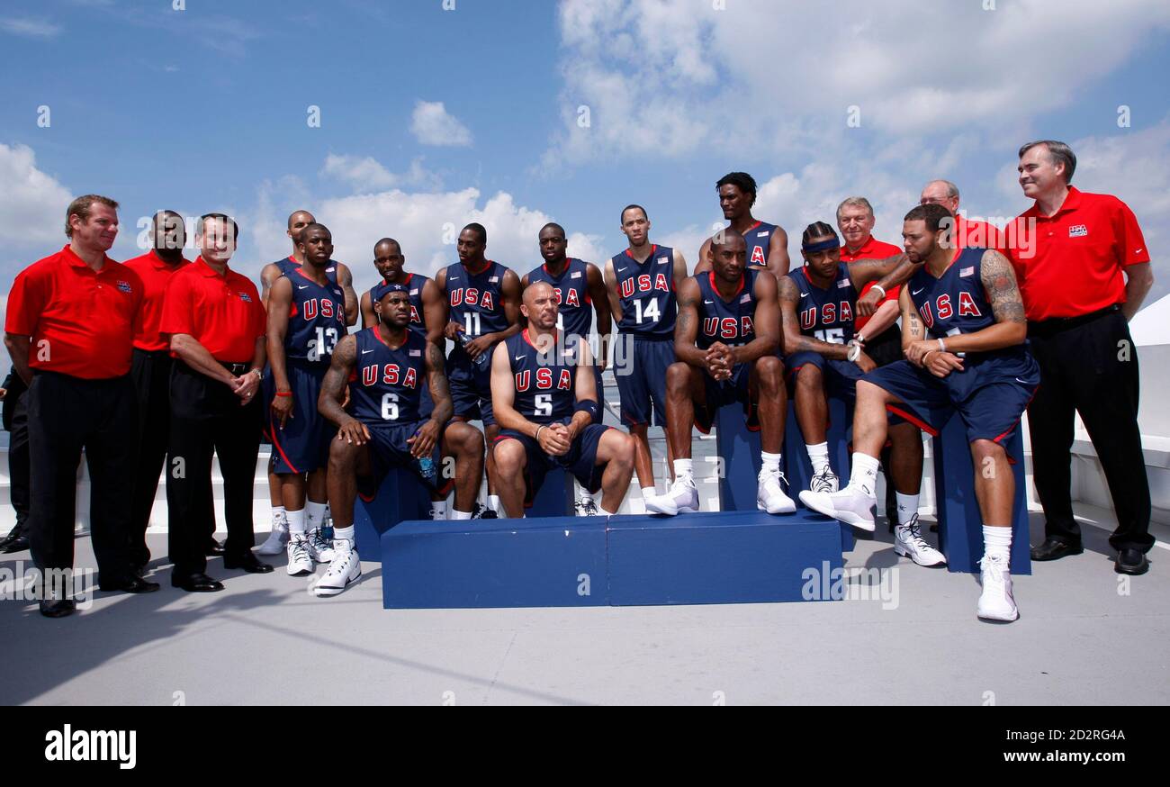 The U S Men S Olympic Basketball Team Pauses For Photographs As They Stand In Their Official Uniforms On The Top Deck Of A Tour Boat Near The Statue Of Liberty During A Team