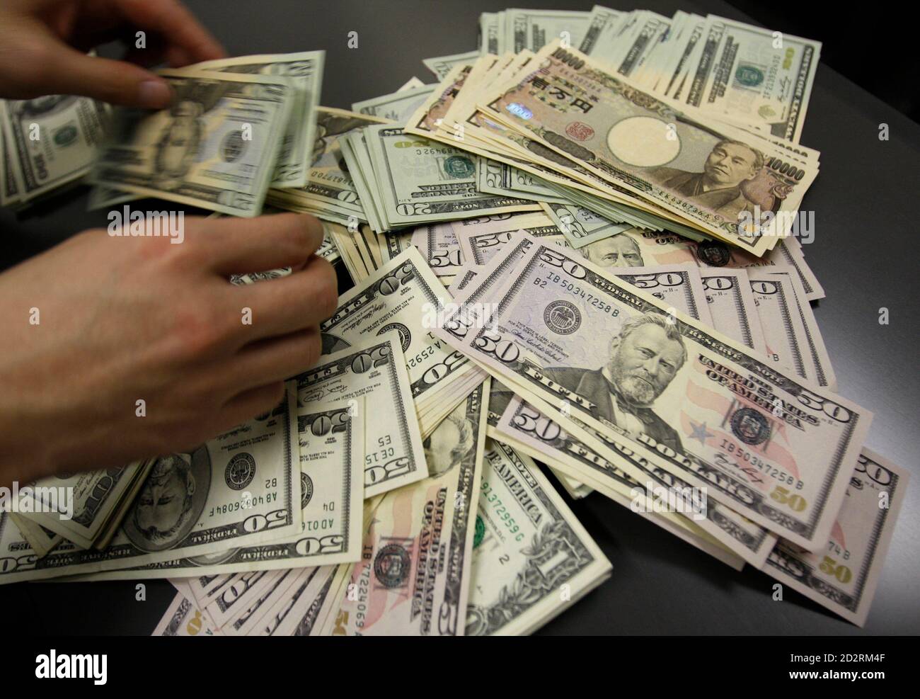 U S Dollar Bills Are Pictured During A Photo Opportunity At An Office Of Interbank Inc Money Exchange In Tokyo November 27 2009 Japan S Finance Minister Raised The Prospect Of A Group Of