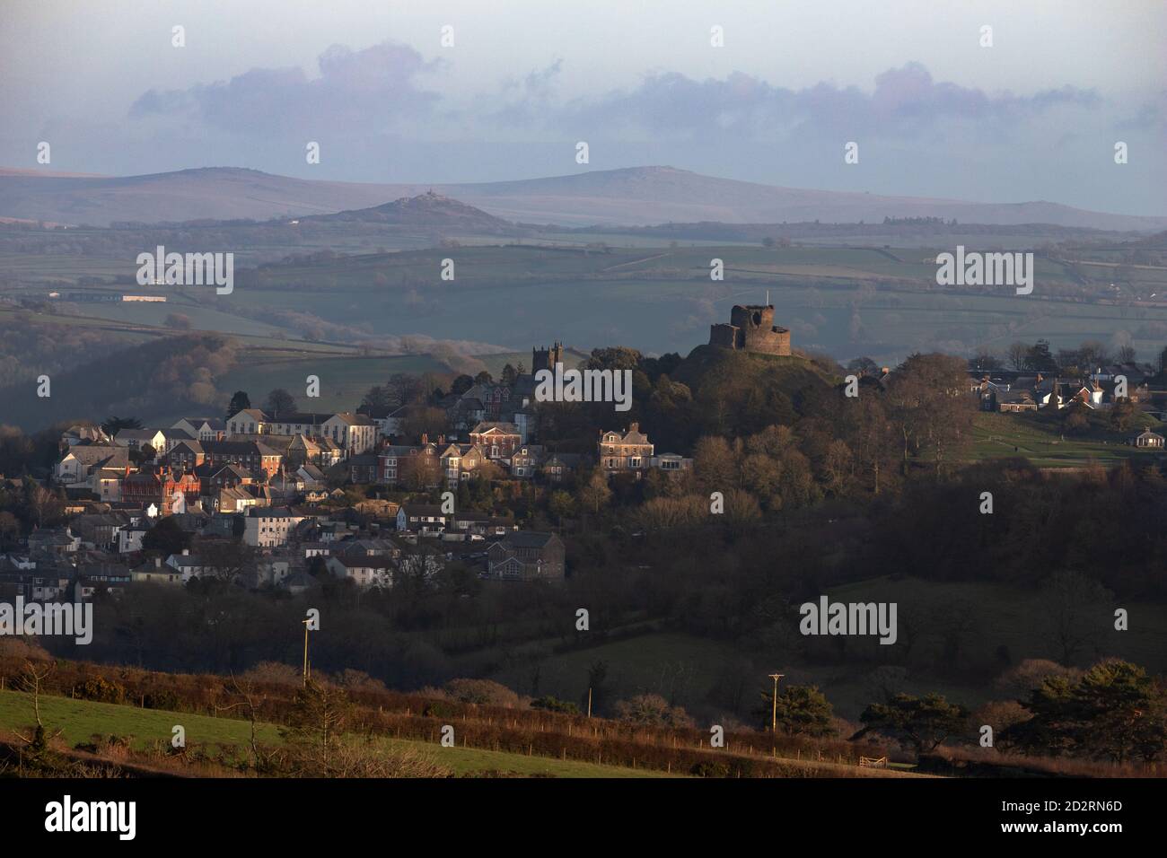 View of Launceston Castle with Brentor Church and Dartmoor behind Stock Photo