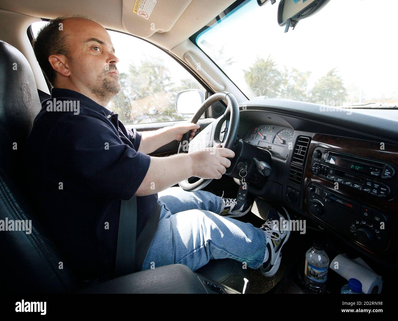 chris-kotzian-drives-his-car-on-a-shopping-trip-in-thornton-colorado-march-25-2010-chris-a-little-person-needs-extensions-on-the-gas-pedal-and-brake-as-he-is-about-4-feet-tall-chris-is-active-in-the-little-people-of-america-the-only-dwarfism-support-organization-that-includes-all-200-forms-of-dwarfism-to-match-feature-life-dwarfism-reutersrick-wilking-united-states-2D2RN98.jpg