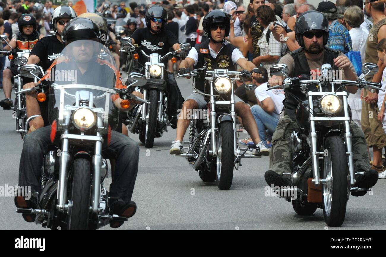 Bikers ride their Harley-Davidson motorcycles as they parade through the  streets of Lugano during the Swiss Harley Days event, July 17, 2010.  REUTERS/Fiorenzo Maffi (SWITZERLAND Stock Photo - Alamy