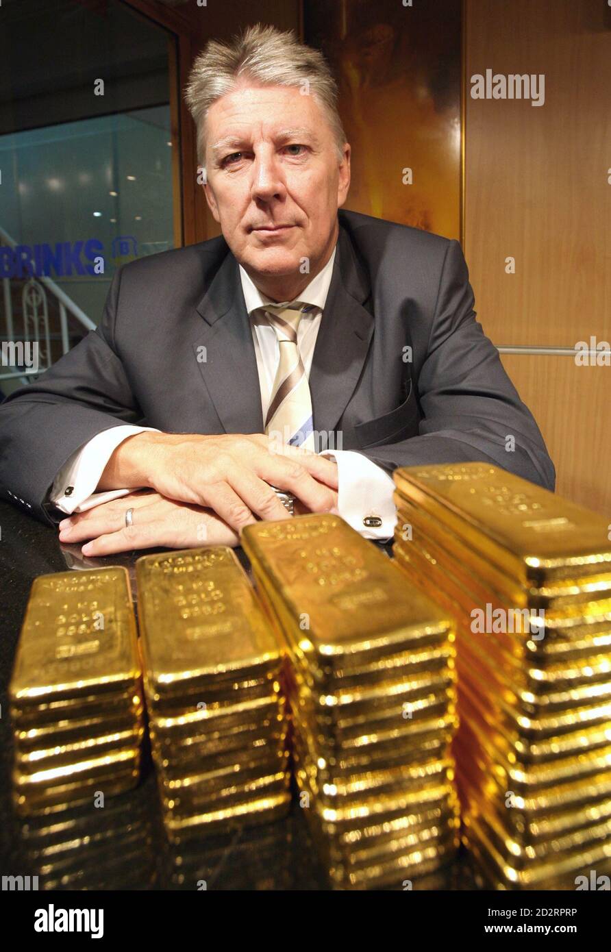Jeffrey Rhodes, head of resource banking operations for South Africa's  Standard Bank in the Middle East and North Africa, sits near several one-kilo  gold bars inside a secured vault in Dubai April