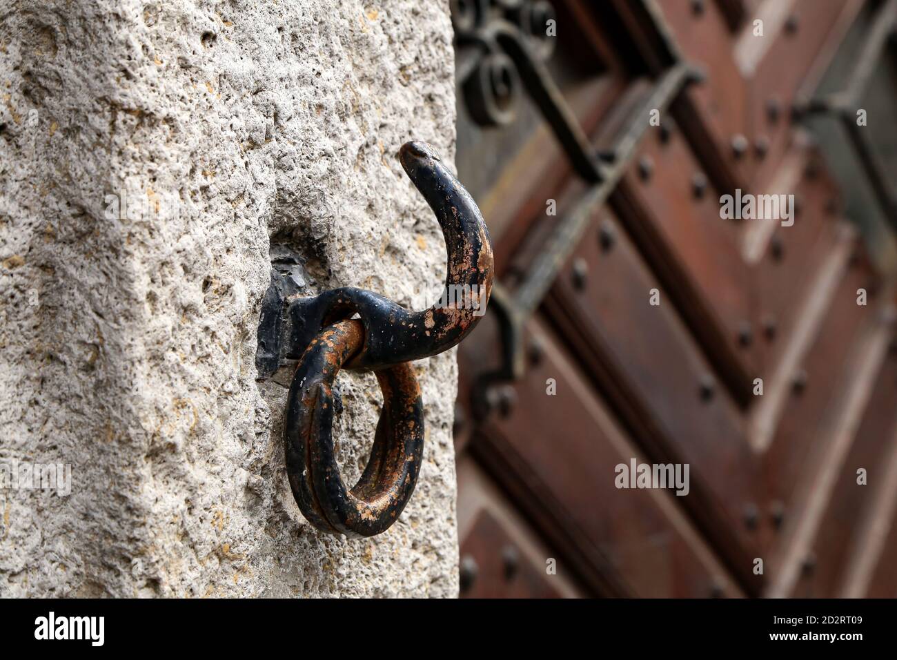 Old rusty hook with a ring at the gate Stock Photo - Alamy
