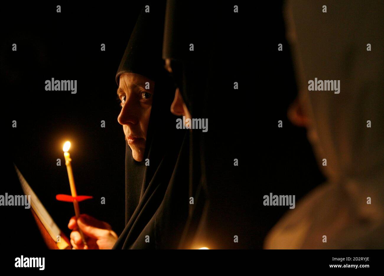 Nuns of Saint-Nickolas monastery attend an Orthodox Easter mass in the town of Maloyaroslavets, some 130 km (81 miles) south-west of Moscow early April, 27 2008. REUTERS/Denis Sinyakov   (RUSSIA) Stock Photo