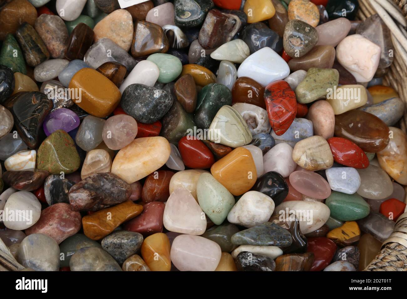 Closeup of a collection of different types of polished pebble stones