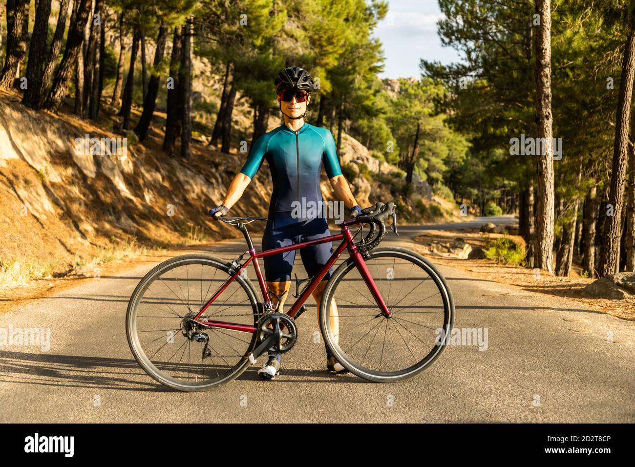 mature Woman training road bike climbing a mountain road showing the bike on the road Stock Photo Alamy
