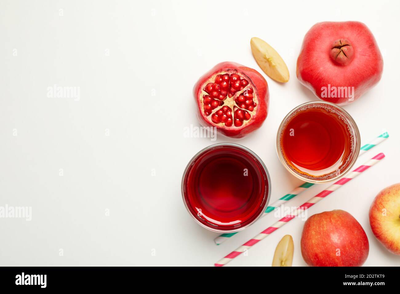 Glasses with apple and pomegranate juices on white background Stock Photo