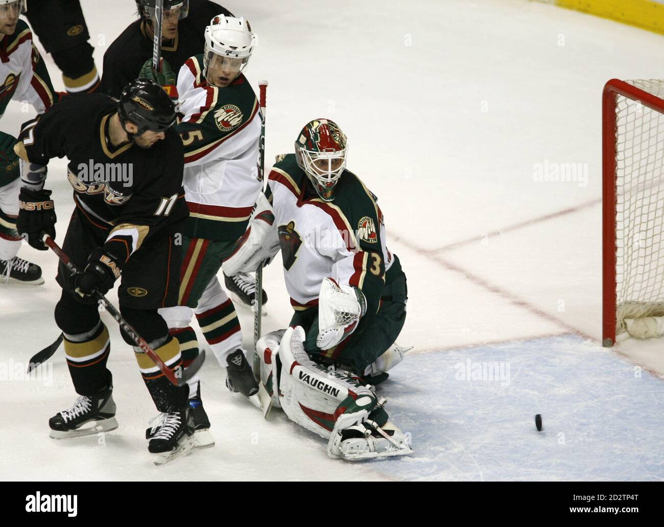 Minnesota Wild defenseman Kim Johnsson (5) and goalie Niklas Backstrom (R) look back into the net along with Anaheim Ducks Dustin Penner (17) and Teemu Selanne, as the Ducks hit the post during the first period of Game 1 of the Stanley Cup Western Conference quarterfinal in Anaheim, California April 11, 2007.  REUTERS/Mike Blake (UNITED STATES) Stock Photo