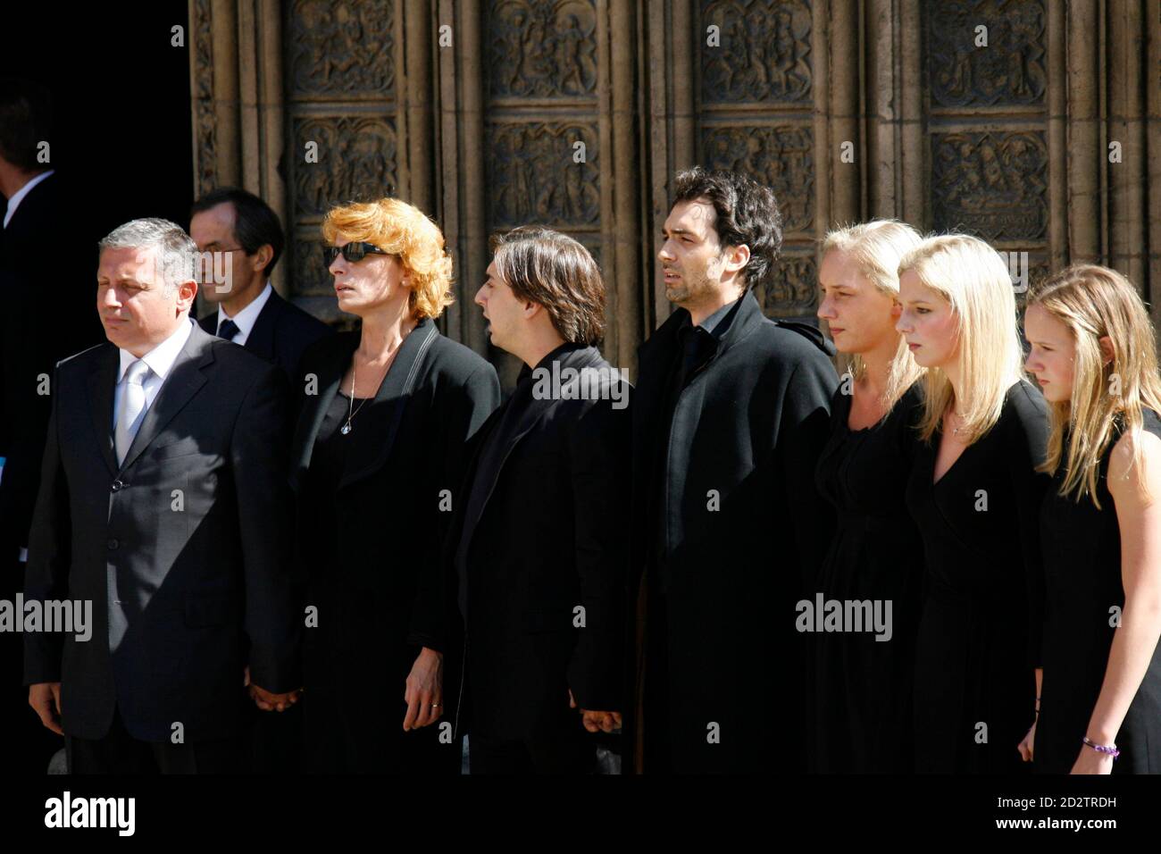Jacques Martin's son David (L-R), an unidentified mourner and other  children Frederic, Jean-Baptiste, Judith, Jeanne-Marie and Juliette attend  the funeral services for French TV host Jacques Martin at the Saint-Jean  Cathedral in