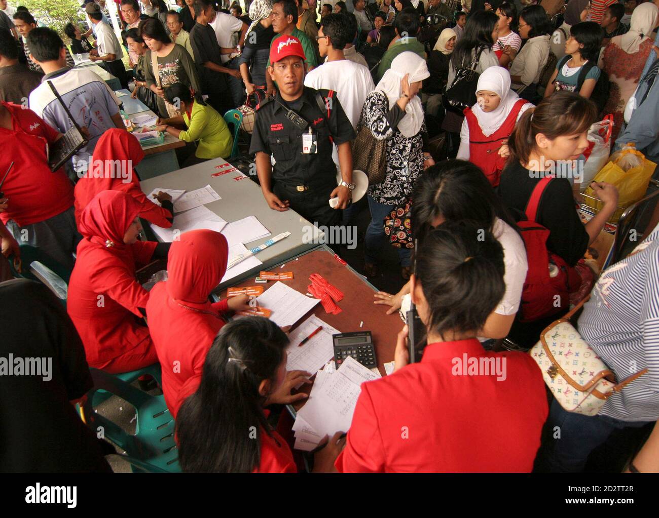 Passengers Queue At A Makeshift Check In Counter At Polonia Airport In Medan North Sumatra December 2 2007 Flights From Polonia Airport In Medan Indonesia S Third Largest City Have Not Been Affected By A