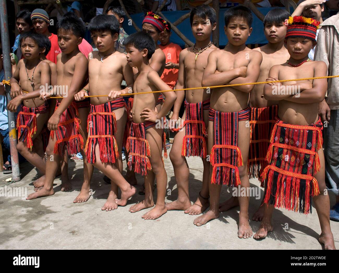 Ifugao children watch traditional games during the Imbayah, a festival that  commemorates traditions of the diverse cultural heritage of Ifugaos, in  Banaue city, Ifugao province north of Manila April 17, 2008. As