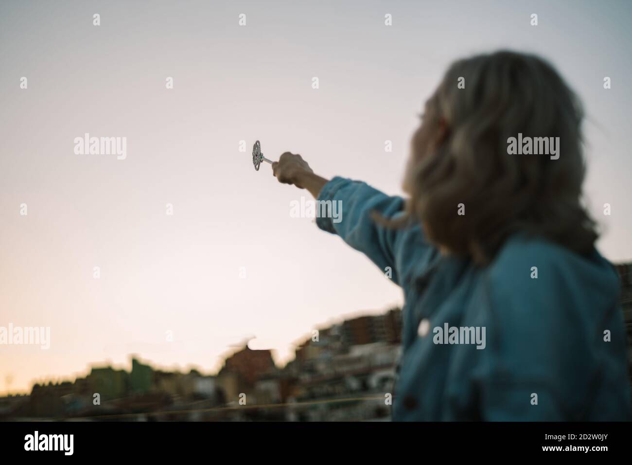 Side View Of Unrecognizable Dreamy Female Sitting On Roof Of Building And Casting Spell With Magic Wand In Outstretched Hand While Looking Away Stock Photo Alamy Side View Of Unrecognizable Dreamy Female Sitting On Roof Of Building And Casting Spell With Magic Wand In Outstretched Hand While Looking Away Stock Photo Alamy