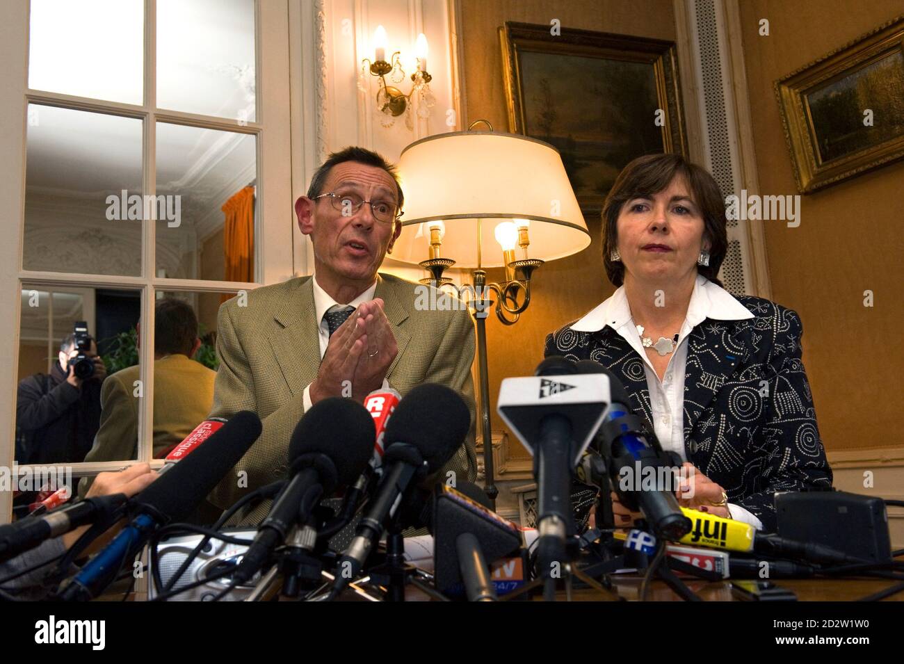 Marie-Christine Chastant-Morand (R) and Thierry Moser, lawyers of Christine and Jean-Marie Villemin, parents of murdered 4-year-old Gregory, hold a news conference in Paris October 22, 2009 about the DNA traces from a man and a woman which were found on a threatening anonymous letter in 'the Gregory Affair'. French detectives have found DNA traces from the child murder case of Gregory Villemin, a 4-year-old boy, who was found dead with his feet and hands bound in a river near his home in eastern France.    REUTERS/Philippe Wojazer  (FRANCE CRIME LAW) Stock Photo
