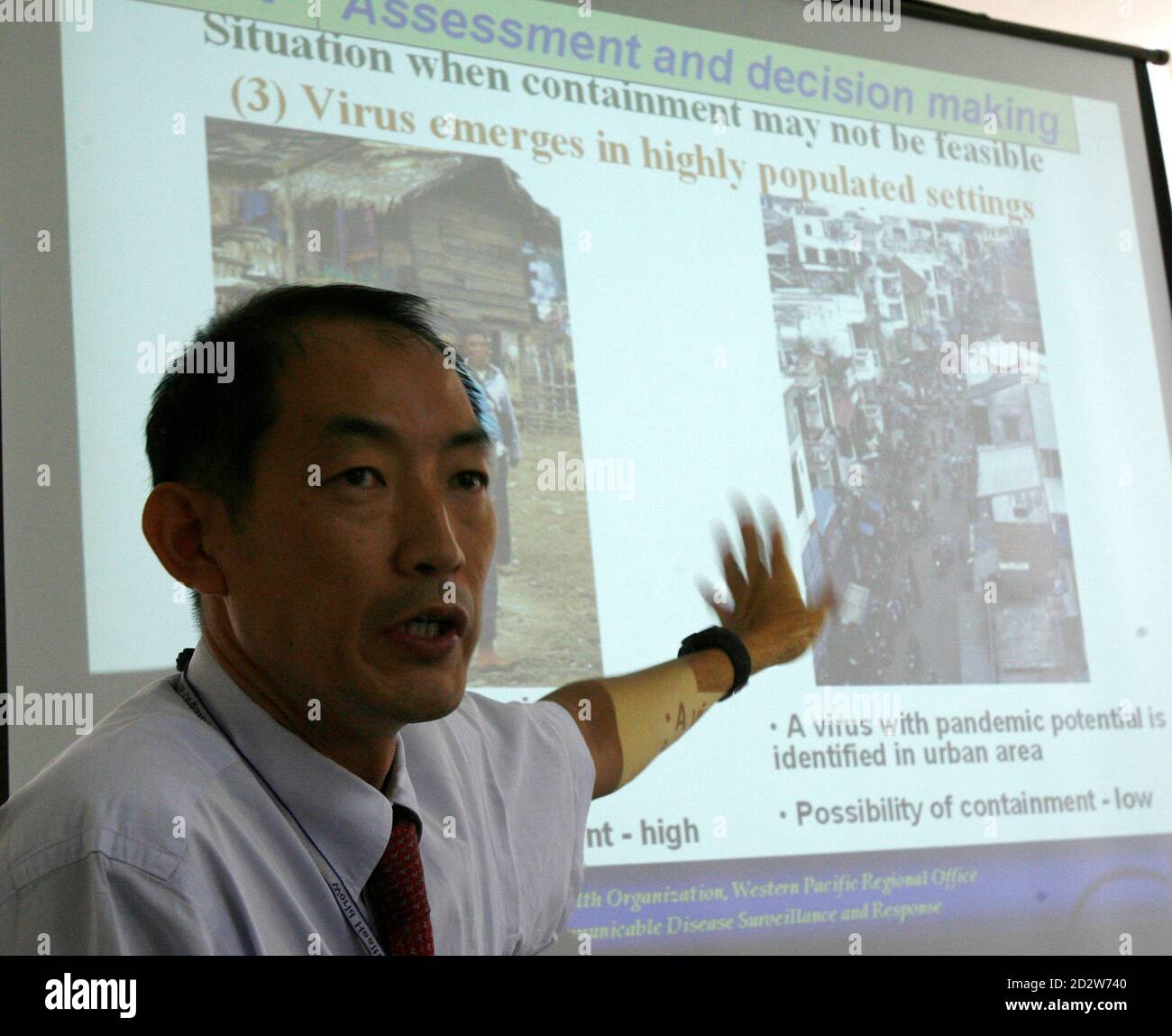 Takeshi Kasai, regional adviser of the World Health Organisation's (WHO) Communicable Disease Surveillance and Response, briefs the media on the birdflu simulation drill conducted by the WHO, Association of Southeast Asian Nations (ASEAN), and Japan at the WHO headquarters in Manila April 2, 2007. The simulation drill assesses how quick the region could respond on the first signs of a human influenza pandemic. REUTERS/Romeo Ranoco (PHILIPPINES) Stock Photo
