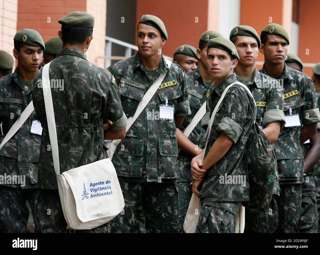 Brazilian army soldiers receive instructions before inspecting homes