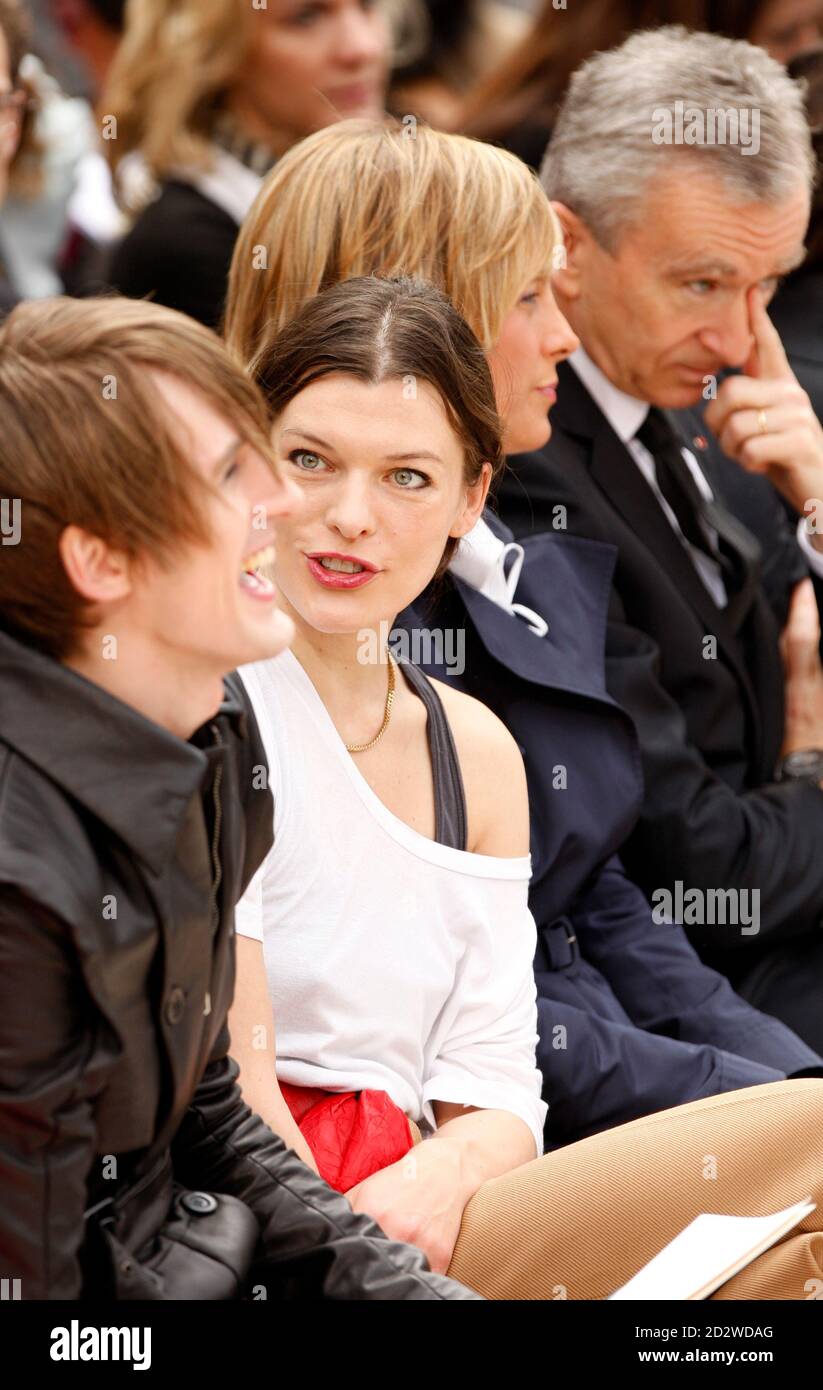Actress Milla Jovovich (2nd L), Helene Arnault (2nd R) and Bernard Arnault  (R), chairman and chief executive officer of LVMH Moet Hennessy-Louis  Vuitton, attend U.S. designer Marc Jacobs' Fall/Winter 2009/10 women's  ready-to-wear