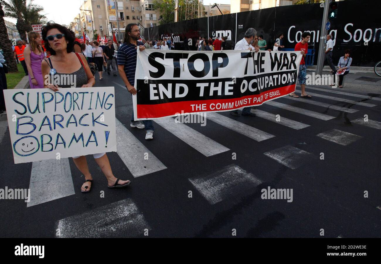 Left-wing activists hold placards and a banner during a protest in Tel Aviv against Israel's occupation of land it captured during the 1967 Middle East War June 6, 2009. REUTERS/Baz Ratner (ISRAEL CONFLICT POLITICS) Stock Photo