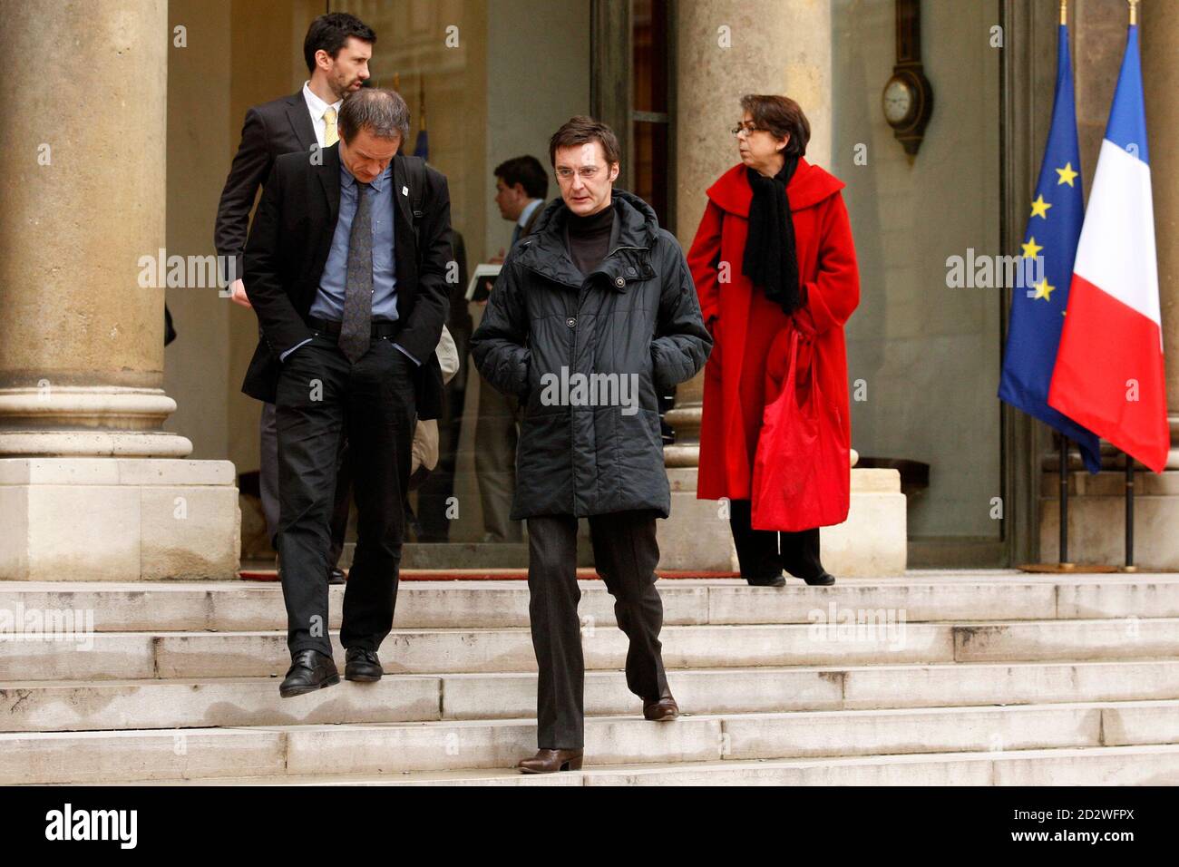 Jean-Stephane Devisse (L), member of WWF France, Pascal Husting (C),  director of Greenpeace France, and Cecile Ostria (R), director of Fondation  Hulot, leave after a meeting with Non Governmental Organisations (NGO) at