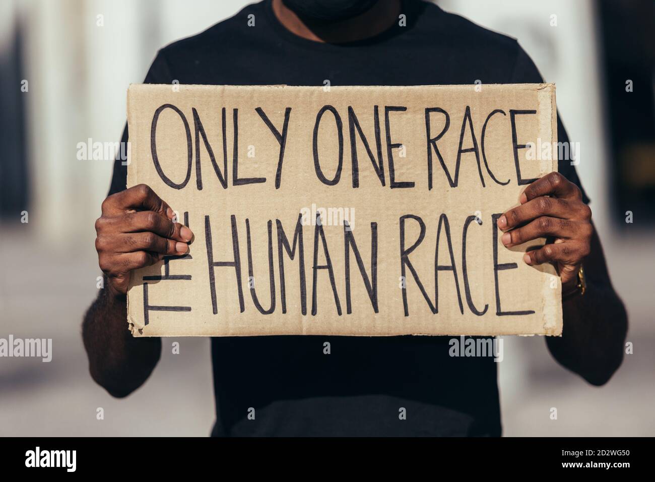 anonymous man protesting at a rally for racial equality against racism. Black Lives Matter. Stock Photo