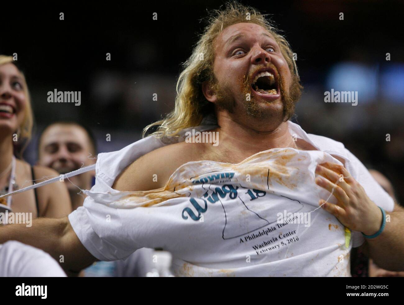 Competitor Douglas Perok "Obi Wing", rips his shirt after vomiting to