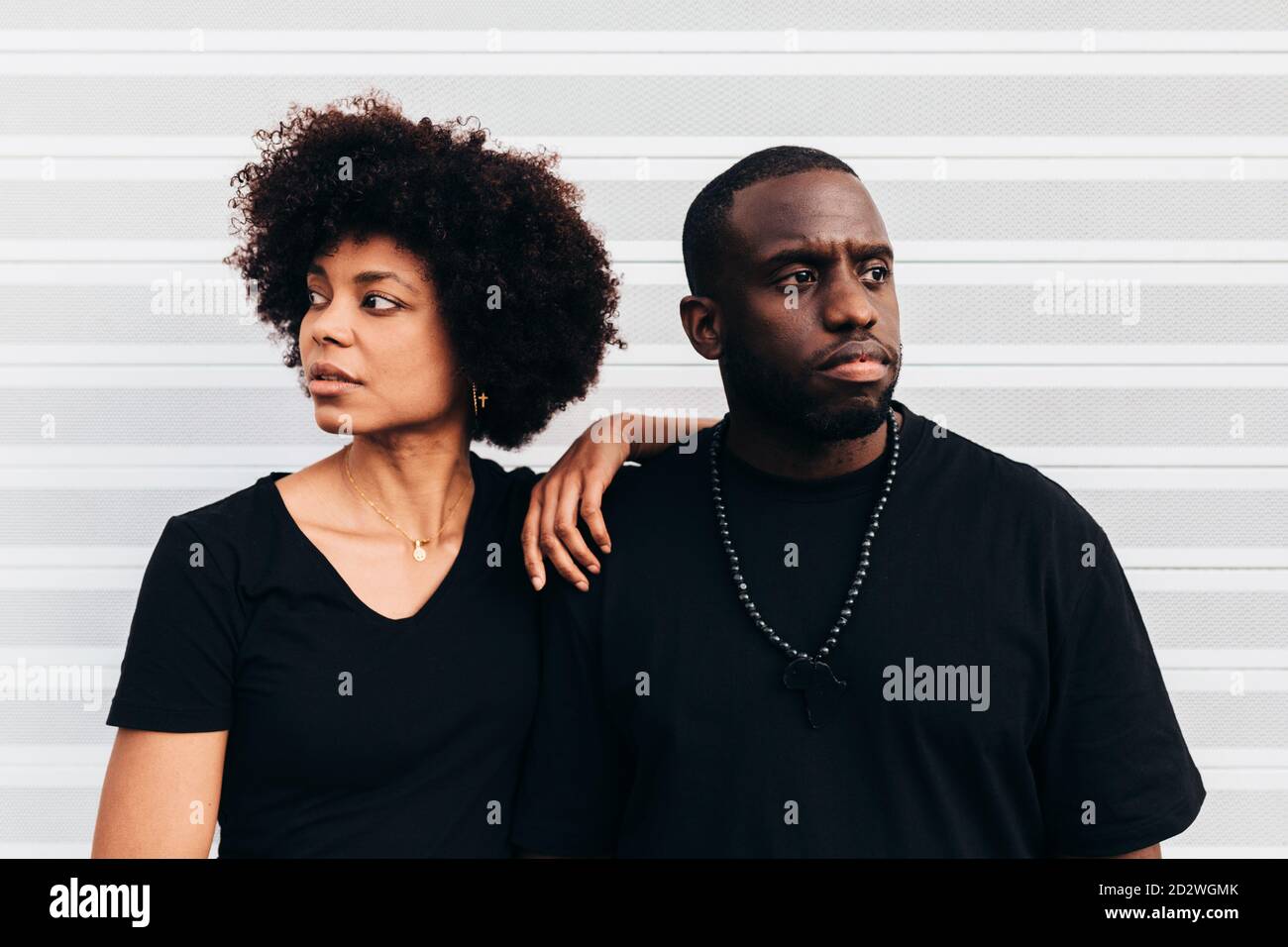 Black cool couple posing over white background looking at camera Stock Photo