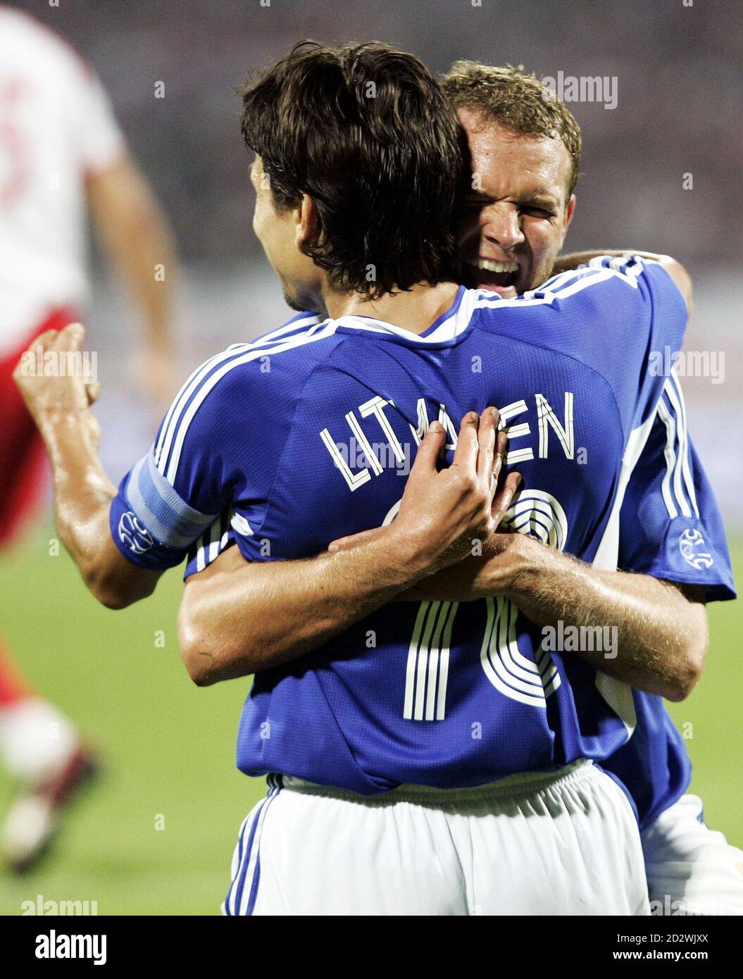 Finland S Jonatan Johansson R Hugs His Team Mate Jari Litmanen After Litmanen Scored Against Poland During Finland S Jonatan Johansson R Hugs His Team Mate Jari Litmanen After Litmanen Scored Against Poland During