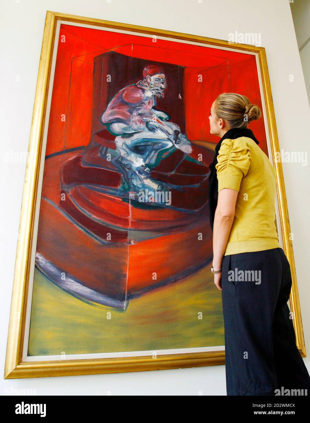 A woman views Francis Bacon's 1962 painting "Study from Innocent X" at  Sotheby's auction house in New York, in this picture taken March 21, 2007.  The painting, which has never before appeared