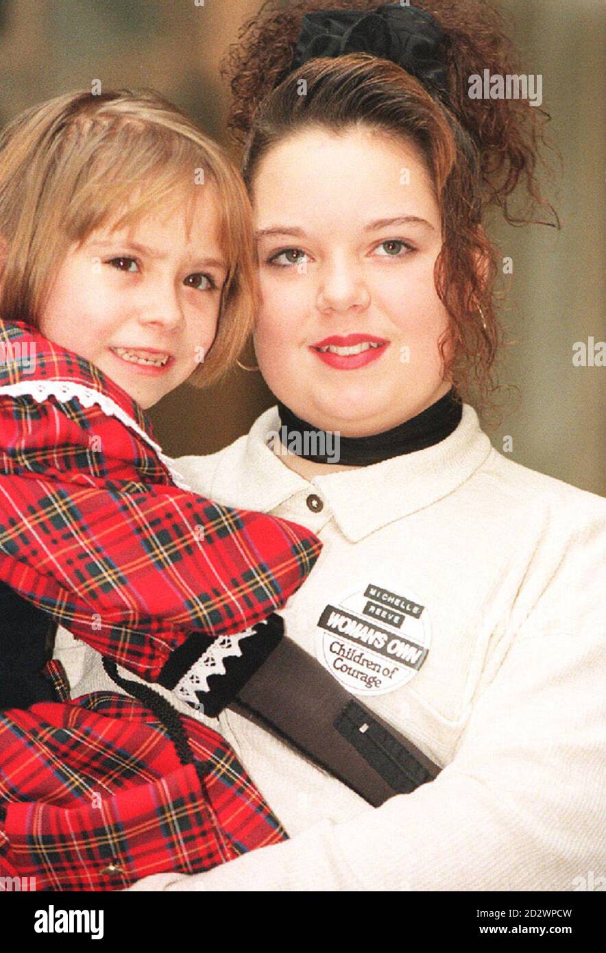 PAP 11: LONDON: 13.12.94: Michelle Reeve, 14, from Middlesbrough, who was stabbed 15 times when a masked knifeman took her class hostage and Abby Bamford, 7, from Lancashire, who suffered horrendous injuries when she was run over in August. Both children are part of the group of eight honoured at the Woman's Own Children of Courage Awards 1994, in London today (Tuesday). Abby lost her left ear, badly damaged her right arm and the damage to her legs was so serious that doctors though she would never walk again. Michelle also saw her friend killed by her attacker. See PA Story AWARDS Children. Stock Photo