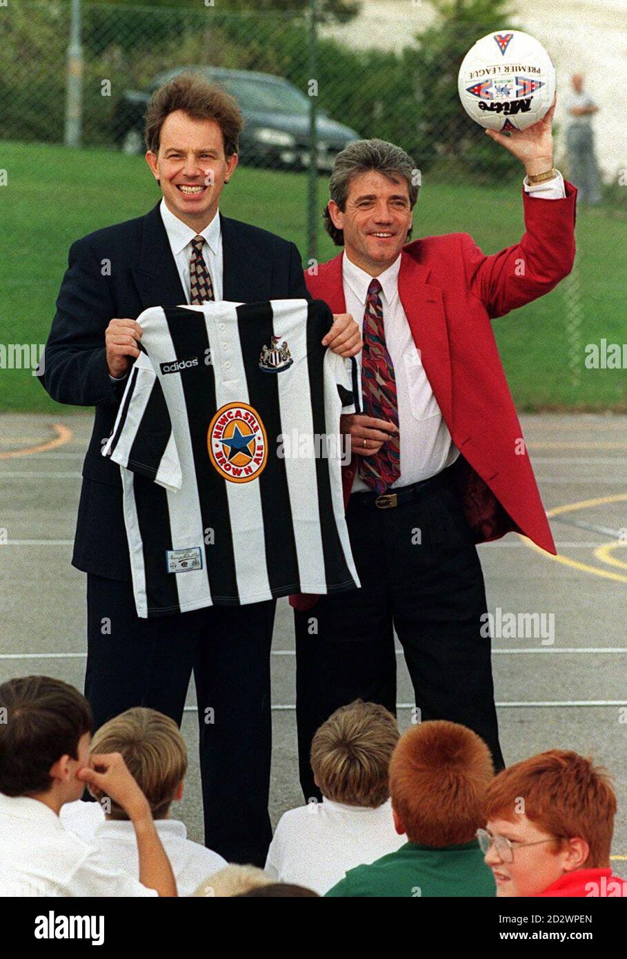 Labour leader Tony Blair (left) is presented with a shirt by Newcastle manager Kevin Keegan in Brighton. The pair later took part in a ball-heading contest during a break in party conference proceedings.   * On 8.1.97 Keegan sensationally resigned as manager of Newcastle United, saying that he no longer wanted to be in football management. Stock Photo