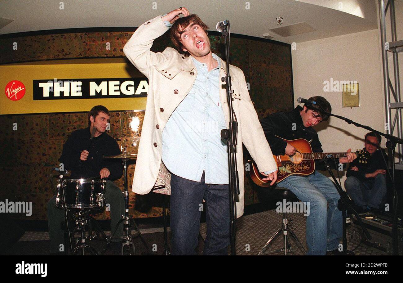 Lead singer Liam Gallagher and rock band Oasis, treat fans to a secret free gig at the Virgin Megastore in London's Oxford Street at midnight, to launch their long-awaited new album.  Stock Photo