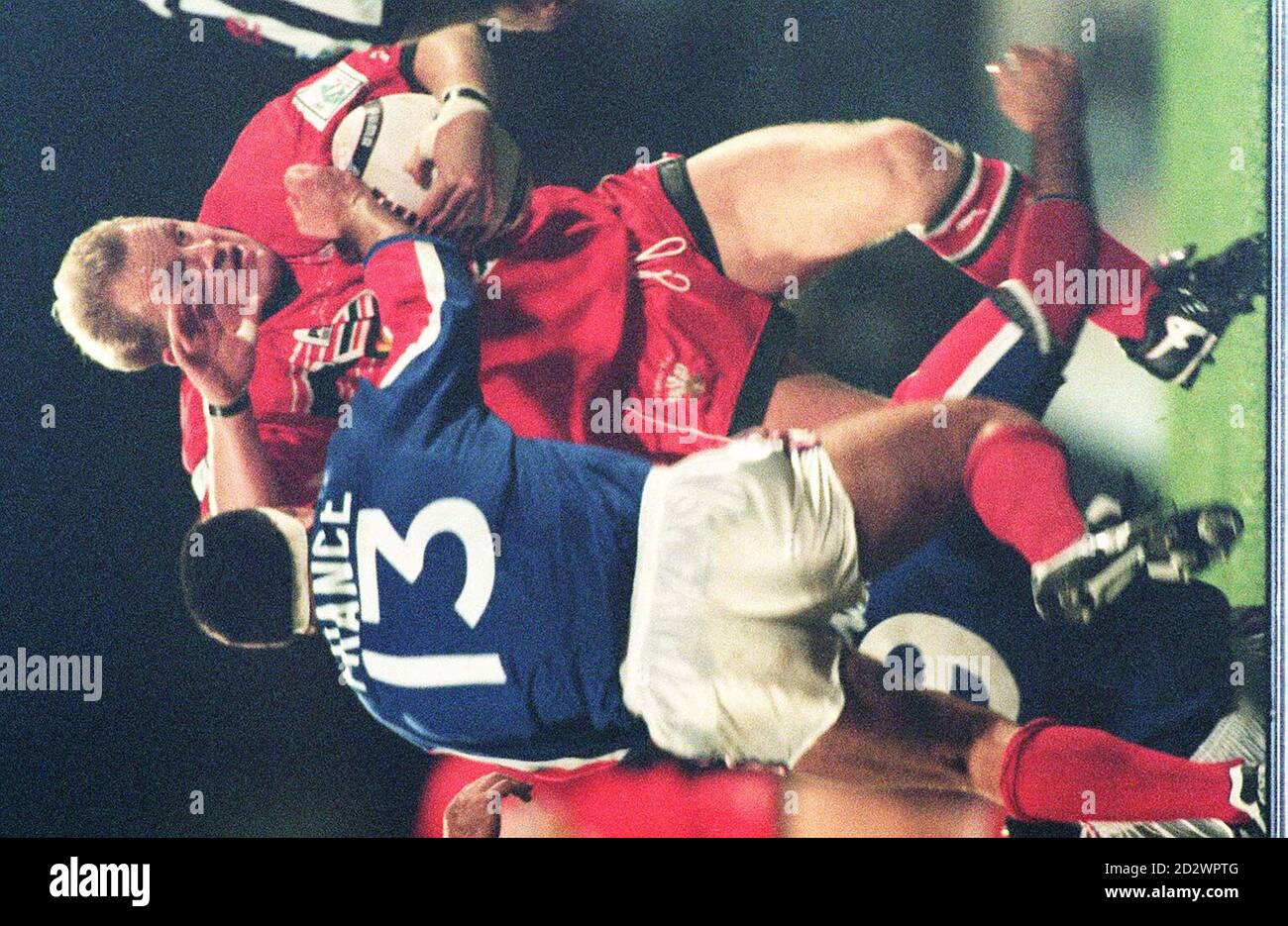 Wales's Martin Hall charges the France defence during tonight's Rugby ...