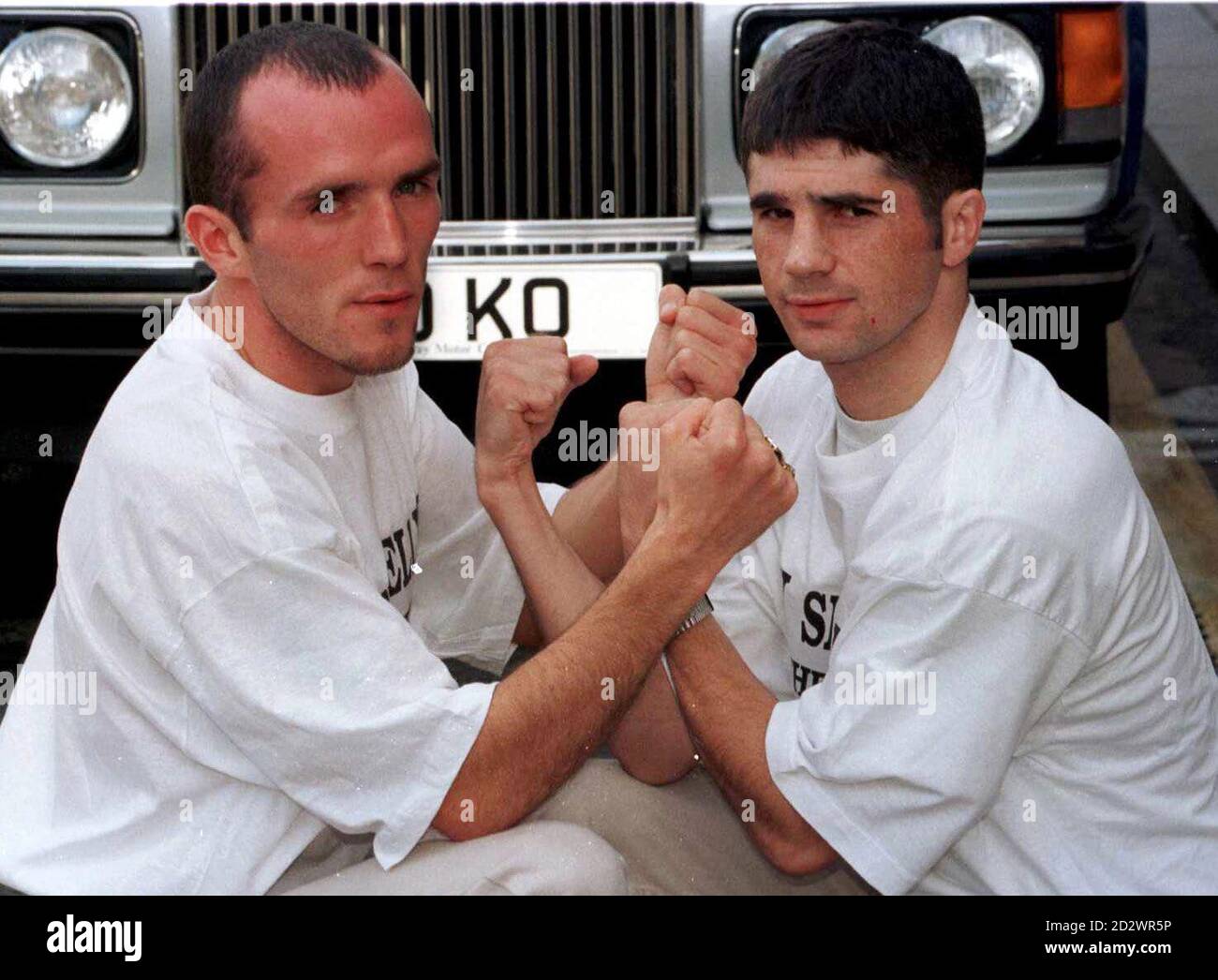 Stricken boxer James Murray (l) poses with British bantamweight champion Drew Docherty before their fight last night during which Murray was stretchered from the ring unconscious and taken to Glasgow's Southern General Hospital to have a blood clot removed from his brain. His condition was described as critical. Stock Photo