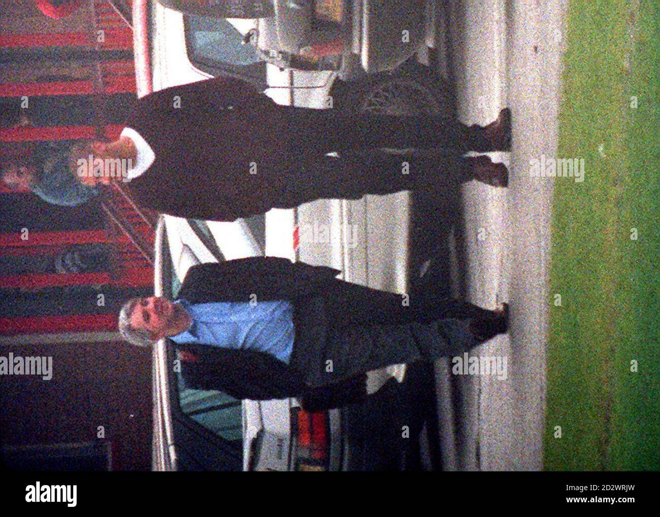 Liverpool striker Stan Collymore (R) is pictured with his agent Paul Stretford leaving the Melwood training after meeting with Reds' boss Roy Evans. Collymore, who set a British transfer record when he moved to Liverpool from Nottingham Forest for 8.5 million during the summer, said in an interview with a magazine over the weekend that he would rather quit football than spend the next two years frustrated in Liverpool's reserves. Stock Photo