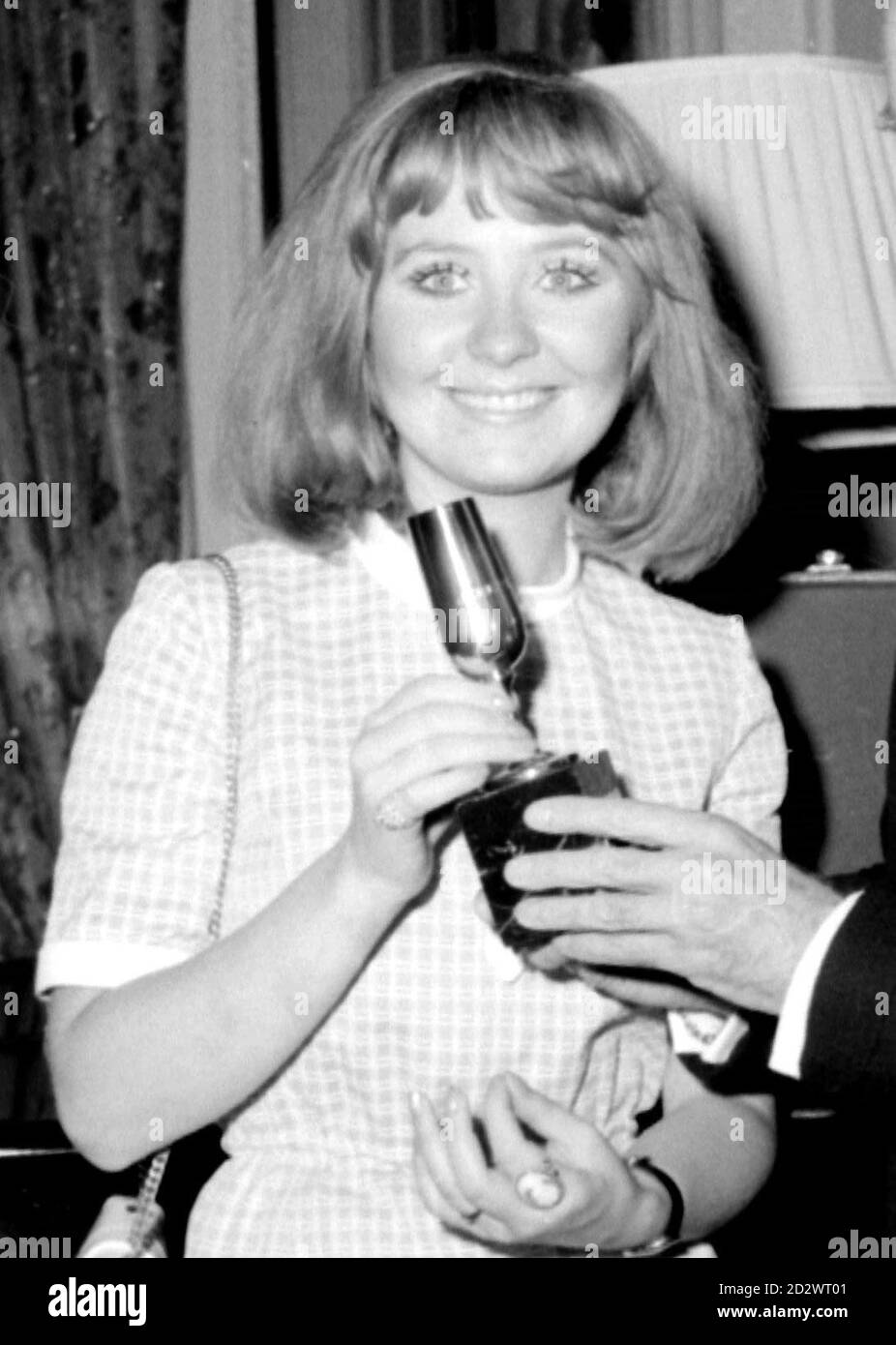 British singer Lulu with her trophy after coming joint first in the Eurovision Song Contest with her song, boom Bang-a-Bang. 26/10/95 It emerged that Britain may not be able to take part in next year's competition if it fails a new qualifying round. Stock Photo