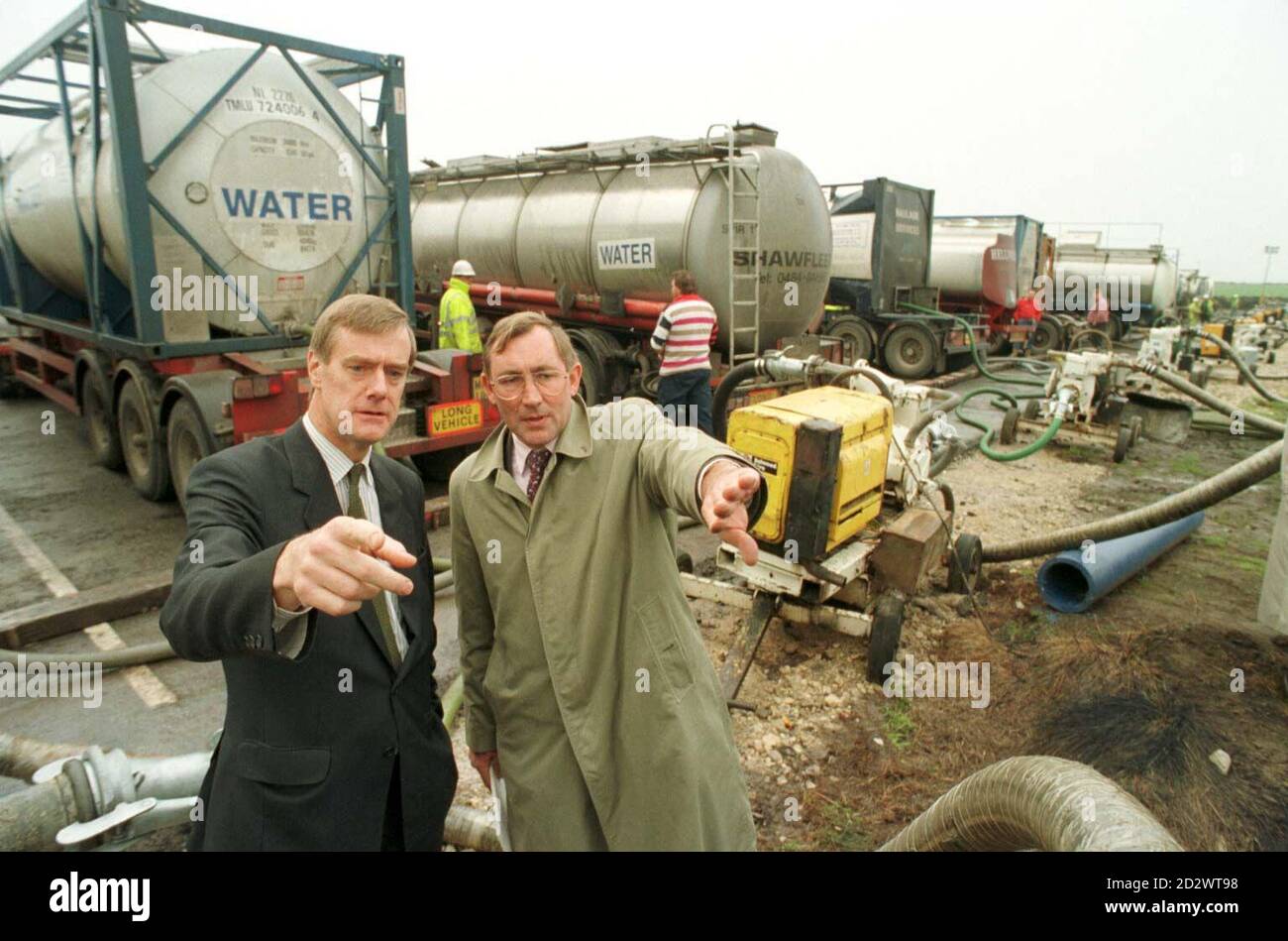 Colne Valley M.P. Graham Riddick (l) and Environment Minister David Curry (r) survey the massive water tankering operation at Scammonden Reservoir in West Yorkshire. Stock Photo