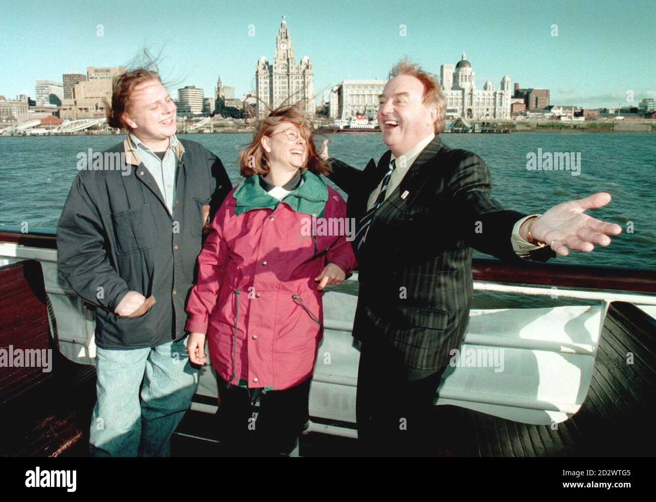 Sixties rock star Gerry Marsden, whose song 'Ferry Across the Mersey', introduces Liverpool's Institute for the Performing Arts students, Jake Ryan and Paula Coppel, to the famous Merseyside water front today (Friday).  Ryan and Paula, two of the first students of Paul McCartney's Fame school, were given a traditional welcome to Liverpool today, by catching the famous ferry. Stock Photo