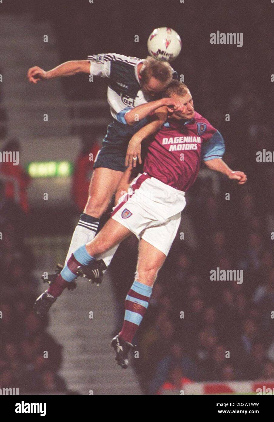 West Ham's Ian Dowie and Mark Wright of Liverpool leap for a high ball during tonight's (Wed) Premiership match at Upton Park. Photo by Adam Butler/PA Stock Photo