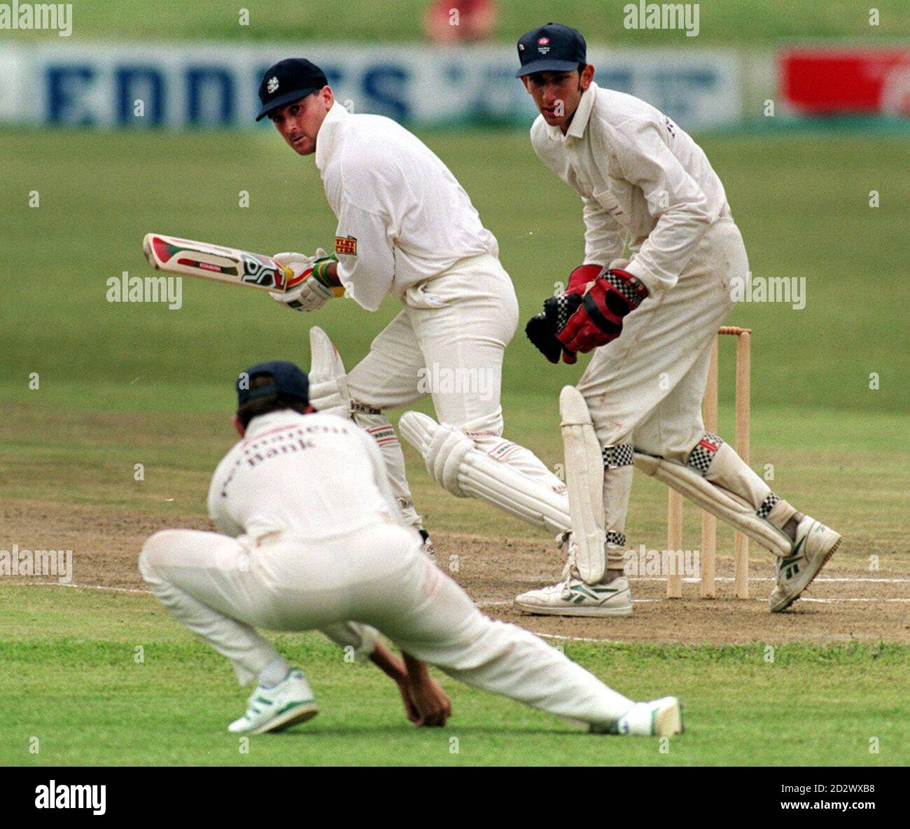 England's Graham Thorpe and wicket keeper Nic Pothas look on as Gerhardus Liebenberg fails to catch the ball during the match at Pietermaritzburg. Stock Photo