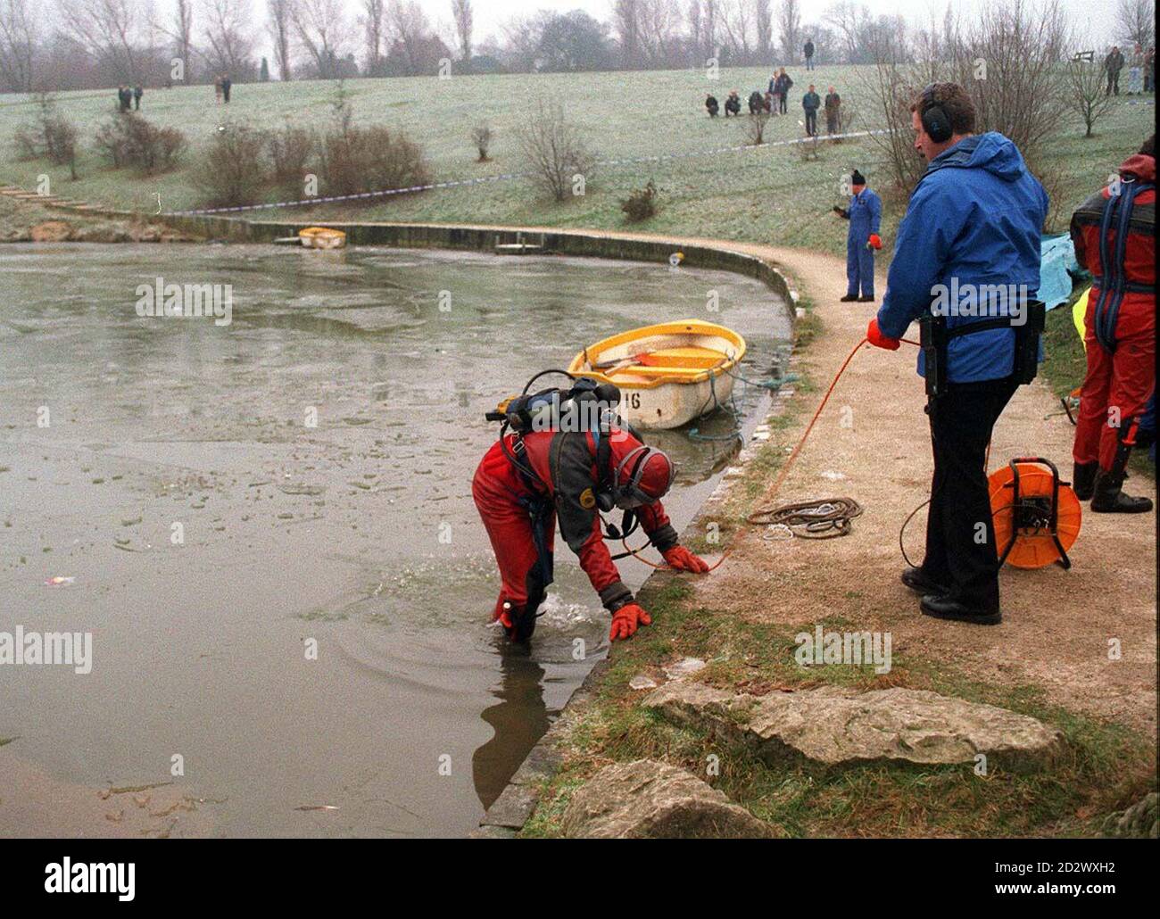 A Police diver searches Hemsworth Water Park Lake, at Kensley, West Yorkshire, today(Thurs) after three people fell through the ice there.  Stock Photo