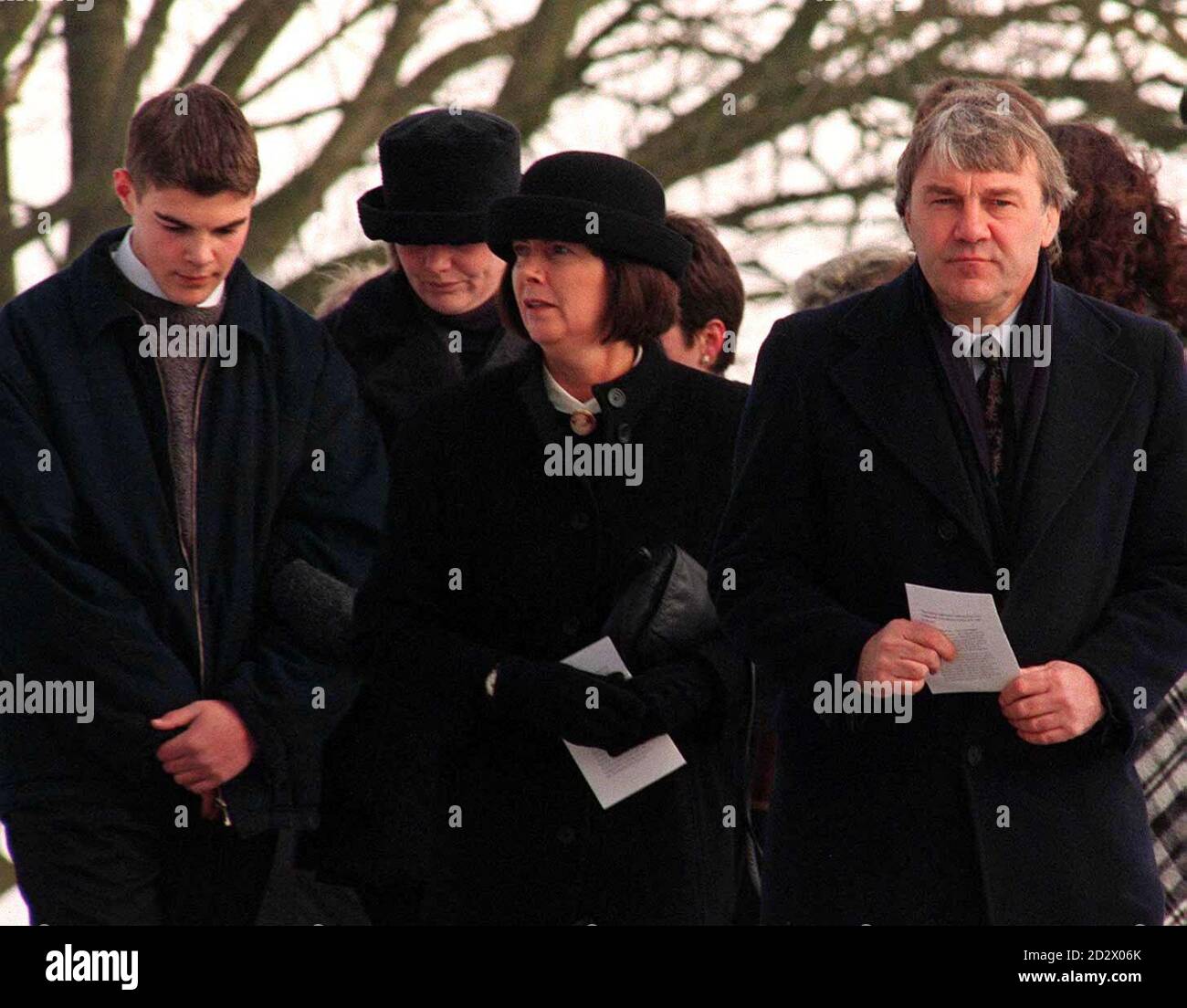 Family in mourning, Stuart and Jackie Masheder with their children Tom and Katie at the funeral of their daughter Johanne who was murdered travelling in Thailand. Her funeral was held in the Peak District village of Wincle. Stock Photo