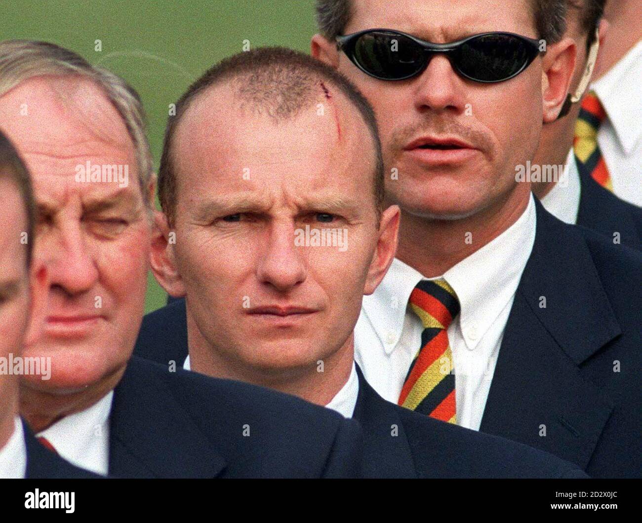 Walking wounded, Neil Fairbrother (centre) who knocked his head in training and Robin Smith, nursing a groin injury, line up behind manager Ray Illingworth at the Cricket World Cup Opening Ceremony in Calcutta. Stock Photo