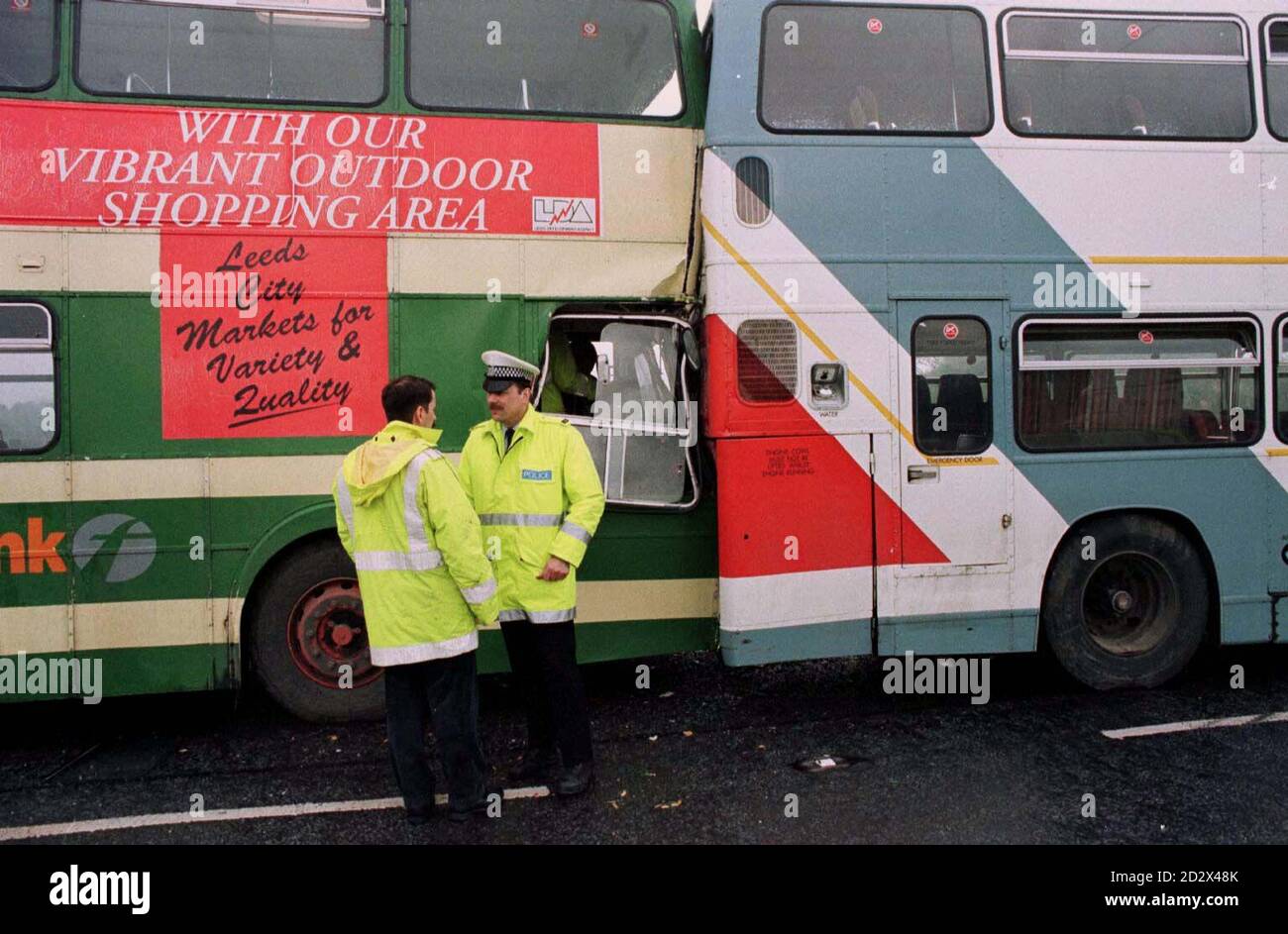 Police and accident officers at the scene of a crash between two school