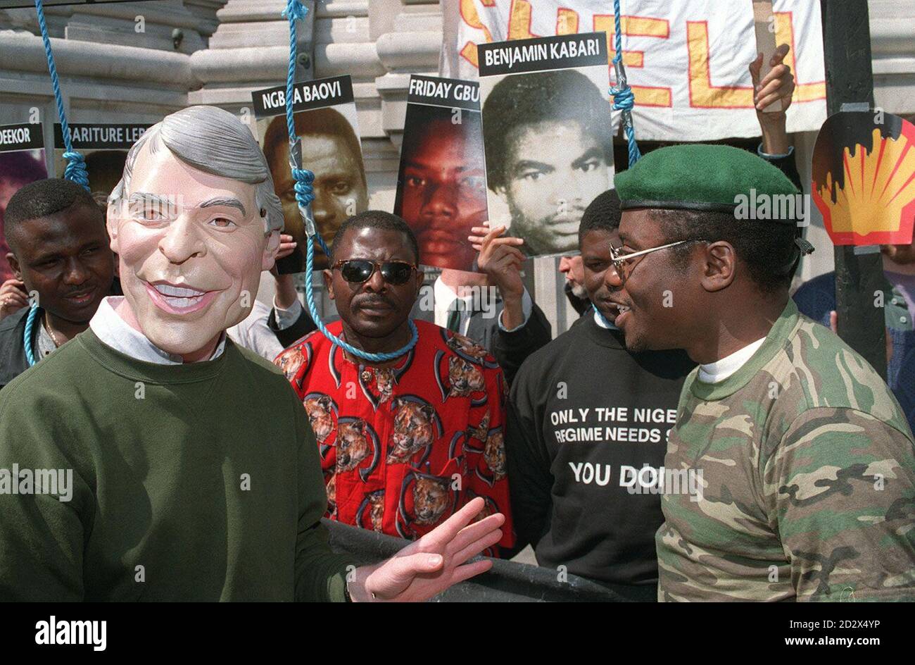 Gen Sani Abacha, head of the Nigerian junta (right) and a man in a John Major mask join demonstrators highlighting Nigeria's human rights record outide the Shell oil company's  annual meeting in London.. Stock Photo
