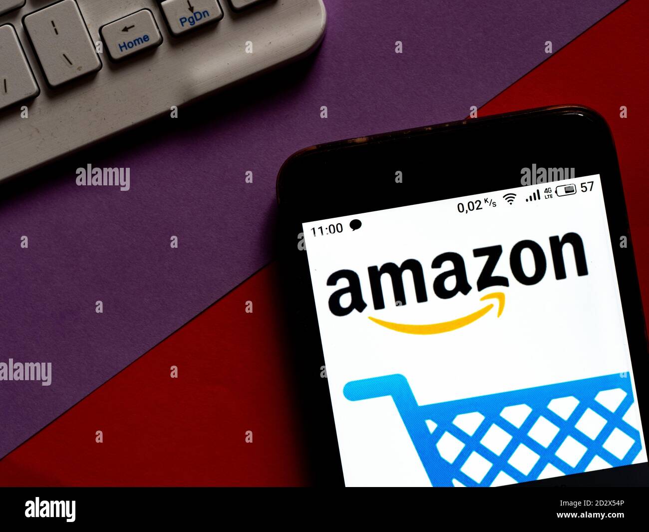In this photo illustration an Amazon Shopping appliance by AMZN Mobile LLC logo is seen displayed on a smartphone Stock Photo
