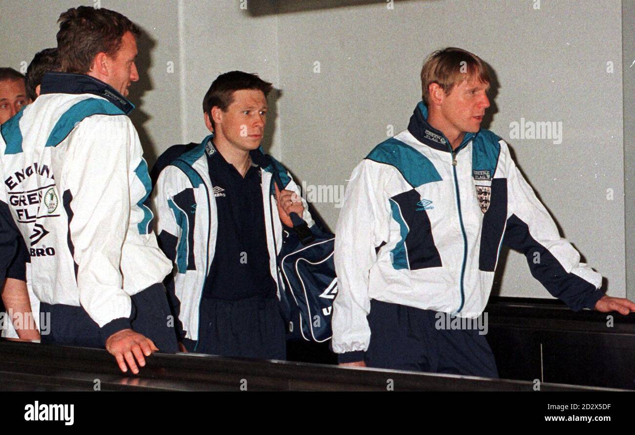 England team (from left) Tim Flowers, Nick Barmbby and Stewart Pearce arrive back at London's Heathrow airport this morning (Tuesday) following the England tour of China ans Hong Kong. The squad for the forthcoming Euro 96 tournament will be announced by manager Terry Venables. Stock Photo
