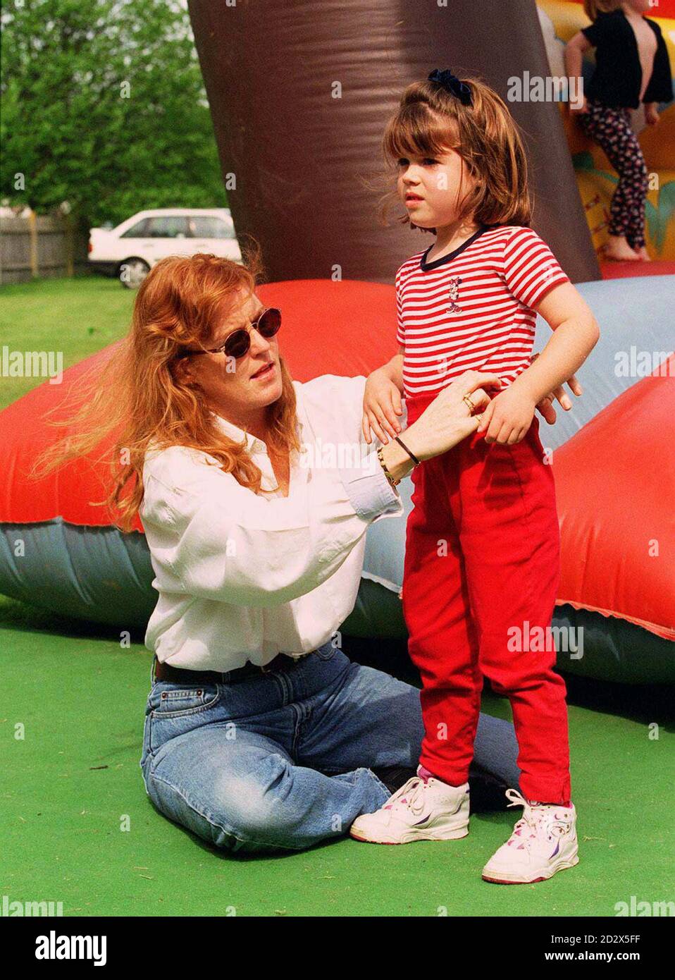 The Duchess of York attends to her daughter Princess Eugenie during a visit to Hickstead for the Enza Nations Cup, on the day her divorce from the Duke of York was declared absolute by a court in London.   * The Duchess, who will no longer be known as 'her Royal Highness', and the Duke issued a statement confirming that 'they remain the closest of friends (and) are dedicated parents, committed to raising their daughters together'. Stock Photo
