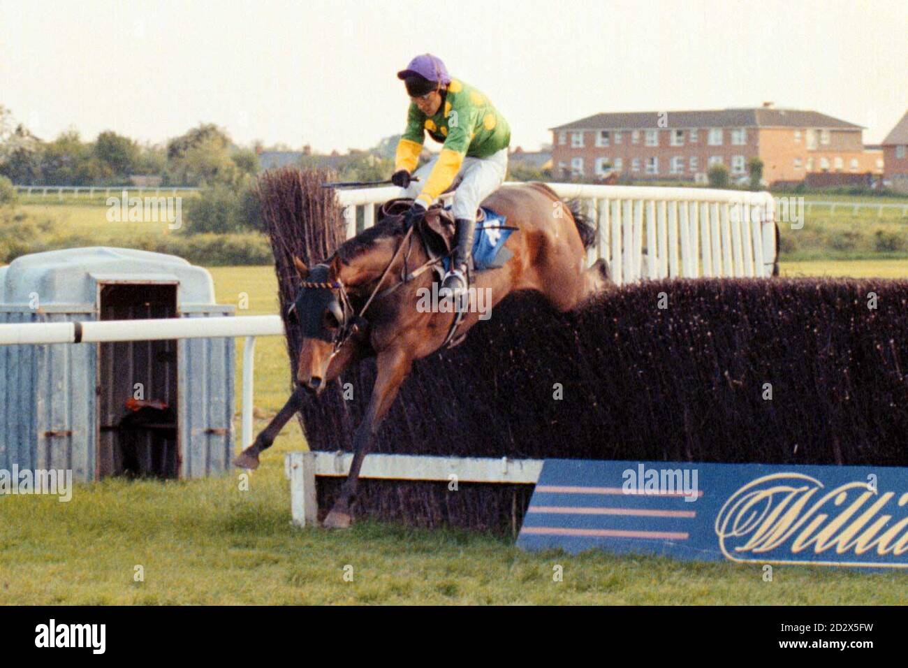 'Robert's Toy' (ridden by David Bridgwater) jumps the last fence before winning to give trainer Martin Pipe his 2000th victory at Hereford races. Stock Photo