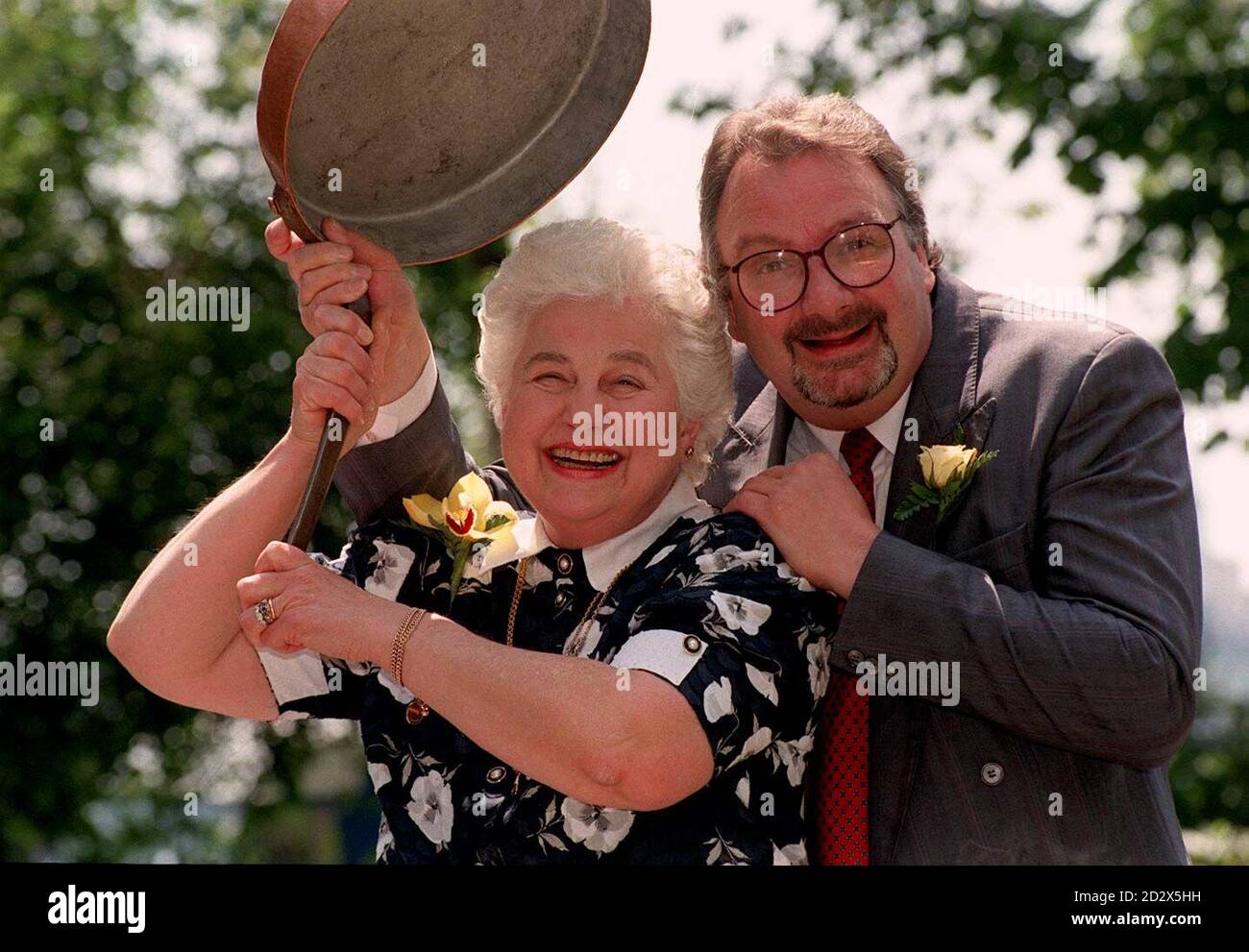 Britain's top bed and breakfast landlady, Muriel Orme, celebrates her good fortune in London with the only male finalist in the contest, Derek Davies, of Caernarfon. Mrs Orme, who runs the Bank House in Oakamoor, Staffordshire, was chosen as the AA's Landlady of the Year 1996 from over 3,500 small hotels, guesthouse, farmhouses and inns listed in the association's guide book. Stock Photo